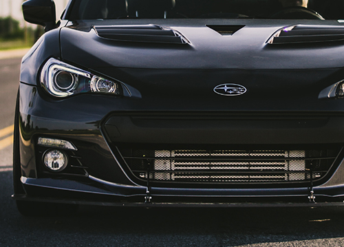 Black Subaru Car with Subaru logo with blue gradient overlay